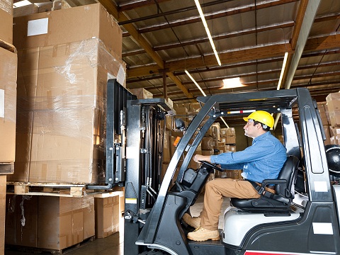 Forklift transports pallets and goods